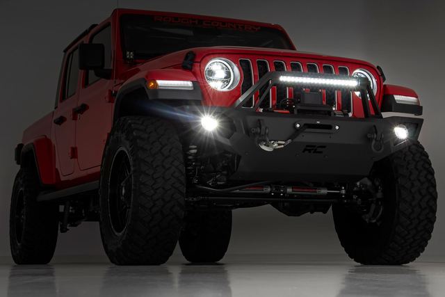 A Jeep Gladiator with a Rough Country bumper and light bar
